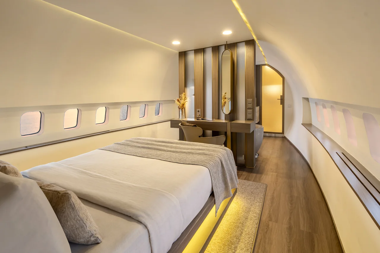 A suite inside the fuselage, ocean beyond the windows